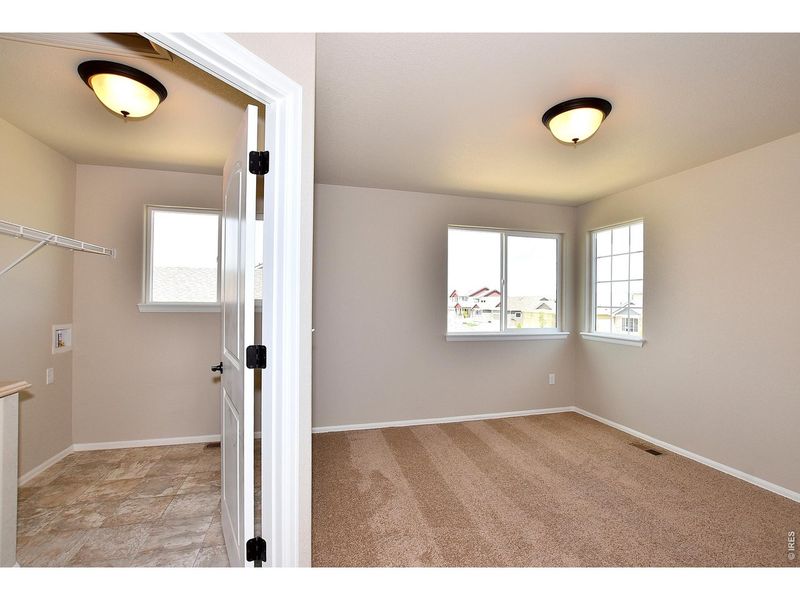 Spacious, unfurnished interior of a new home in Union Colony West, Greeley (Image 28).