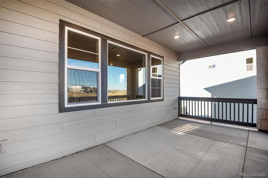 Exterior details and patio area of a home in Prelude at Sterling Ranch, Littleton (Image 26).