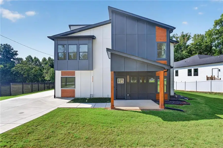 Front exterior of a new home in , Mableton, GA, highlighting curb appeal (Image 1). Front exterior of a new home in , Mableton, GA, highlighting curb appeal (Image 1).
