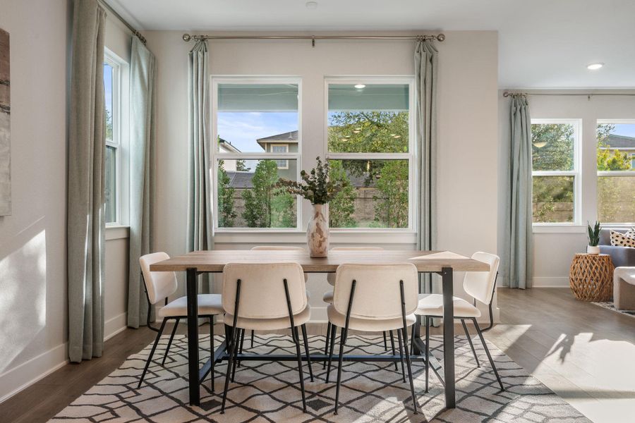 Large dining area with custom window treatment & great natural lights.