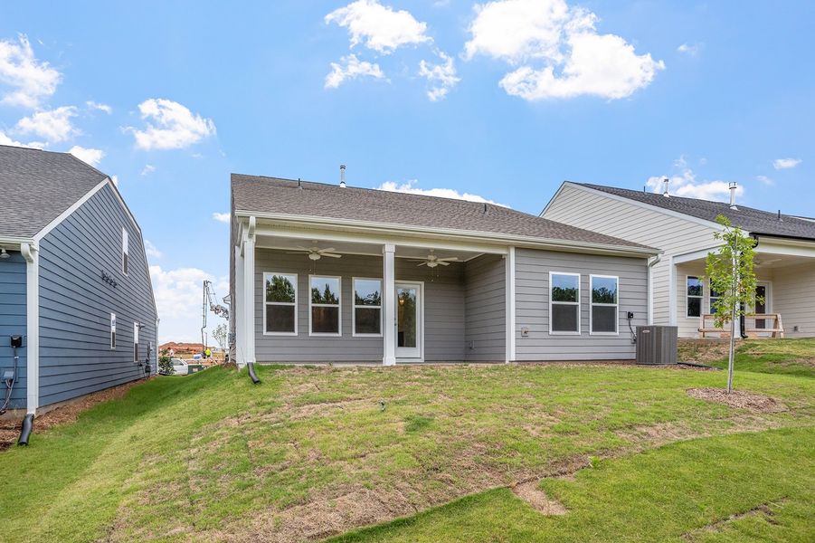 Exterior details and patio area of a home in Ovation at Sweetbrier, Durham (Image 4).