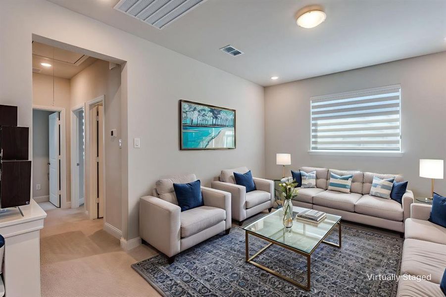Living room with attic access, light colored carpet, and recessed lighting Living room with attic access, light colored carpet, and recessed lighting
