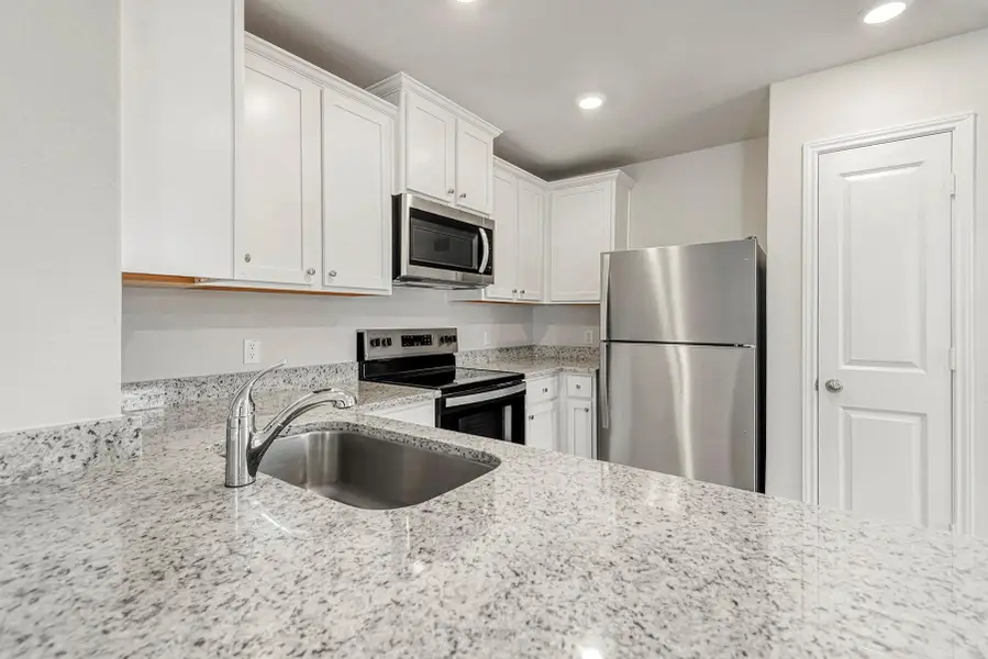 Furnished interior view inside a new home in Vacek Country Meadows, Richmond (Image 2).