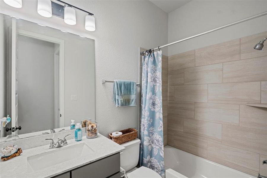 This hall bath is a full bath that is accessible to all guest and the other two bedrooms