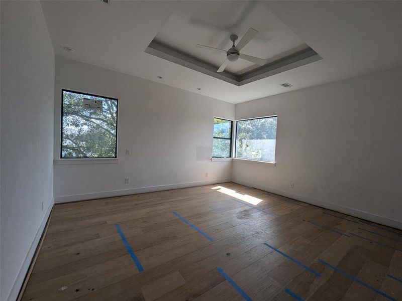 Master bedroom with large corner windows.