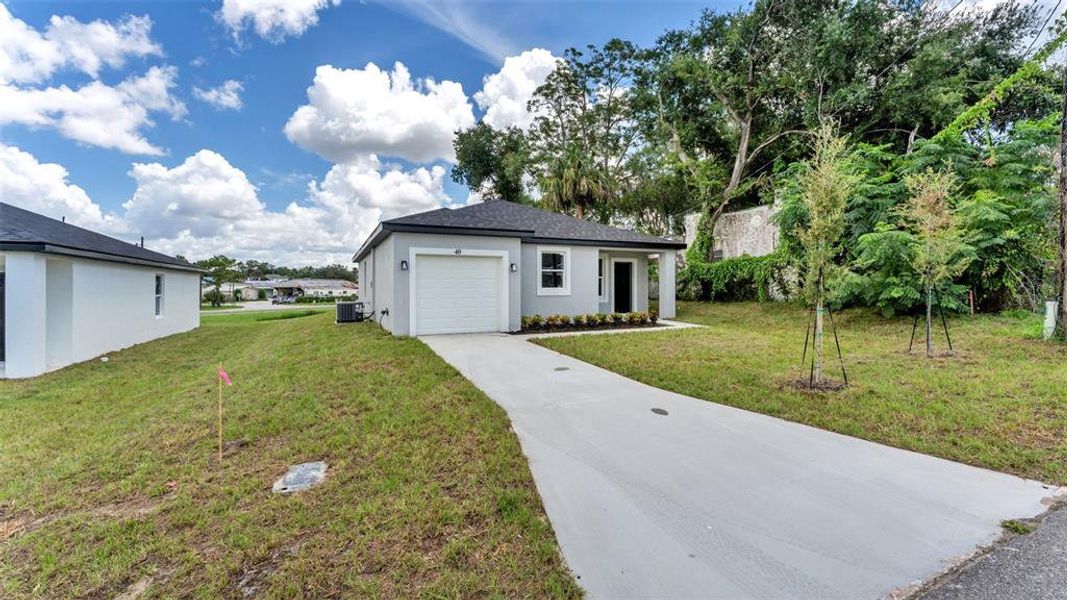 Front exterior of a new home in , Haines City, FL, highlighting curb appeal (Image 18). Front exterior of a new home in , Haines City, FL, highlighting curb appeal (Image 18).