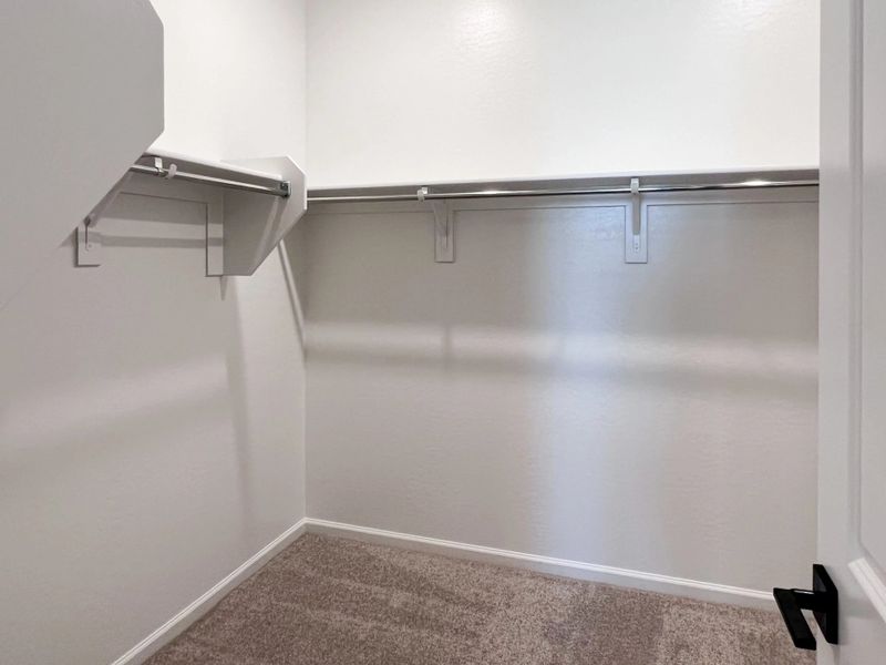 Primary walk in closet Primary walk in closet