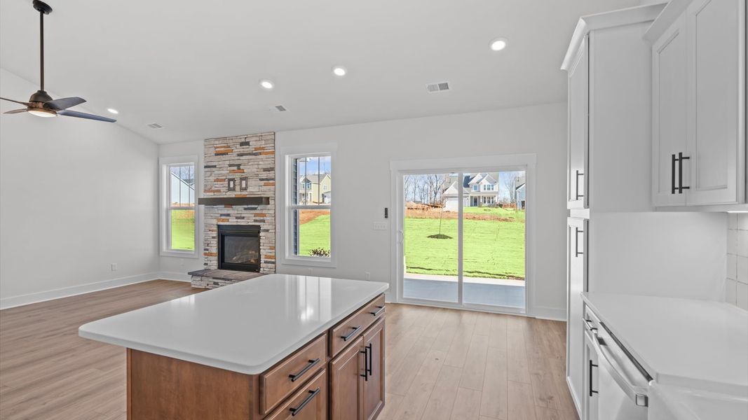 Elegant and compact island anchors this tasteful kitchen with high standards and timeless appeal