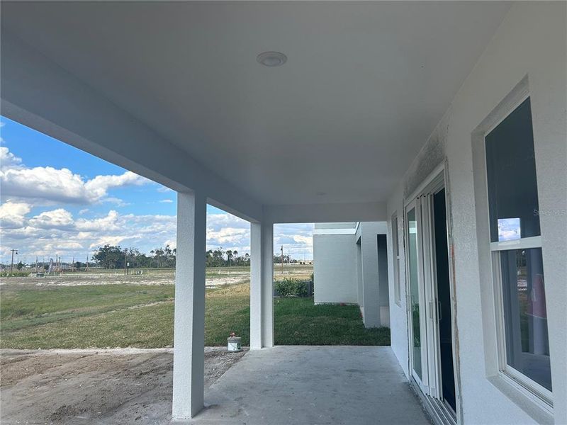 Exterior details and patio area of a home in Oakfield Trails, Parrish (Image 3).