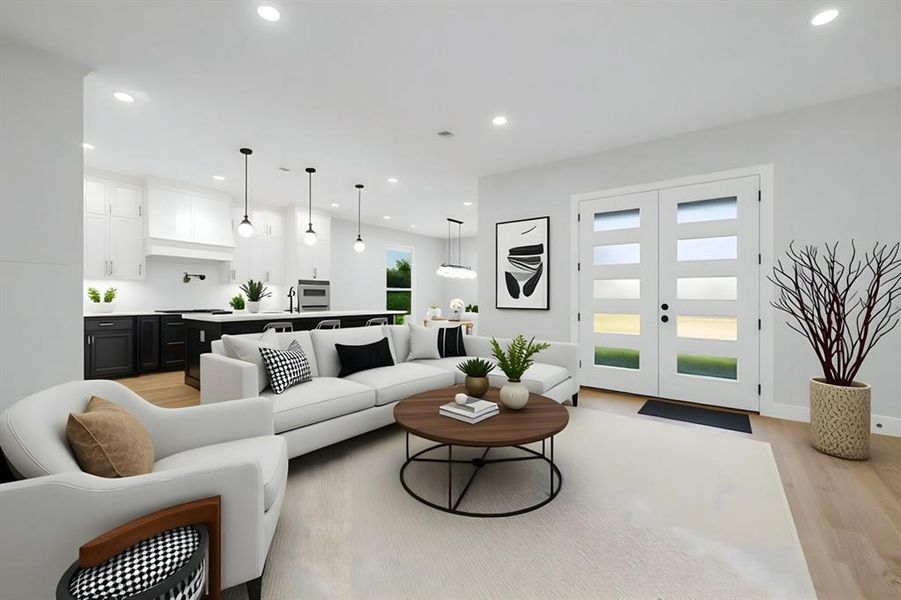 Living area with french doors, light wood finished floors, and recessed lighting