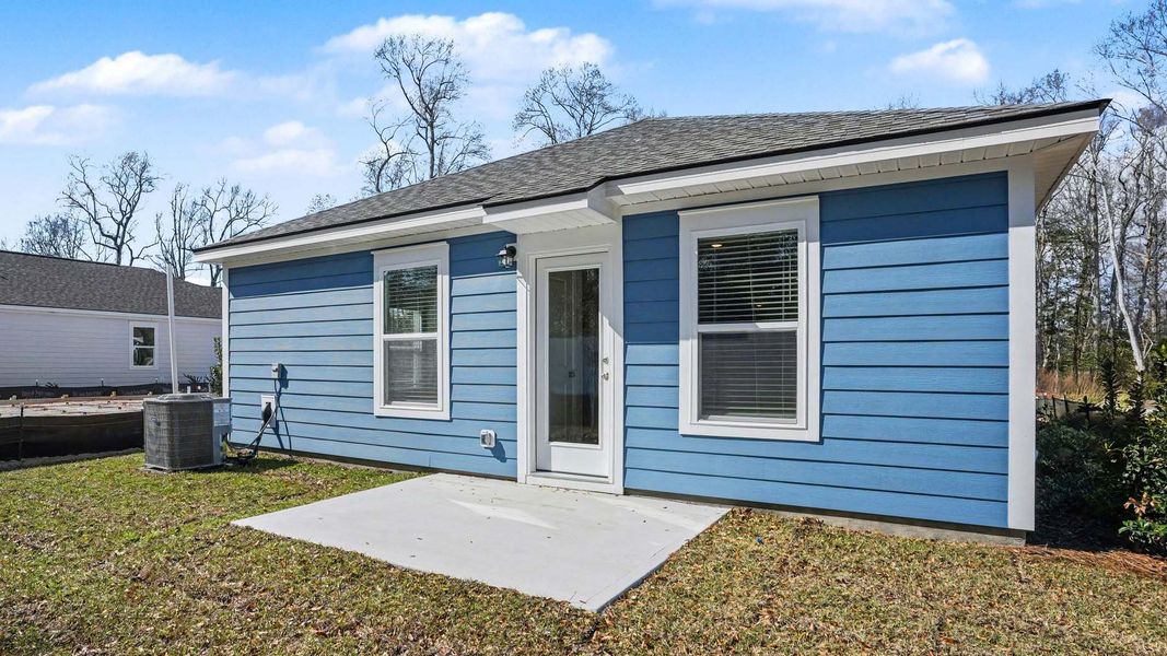 Exterior details and patio area of a home in Southshore Bay, Sunset Beach (Image 3).