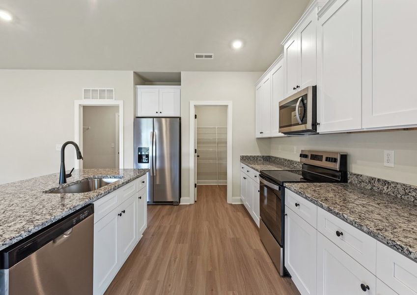 The kitchen has granite countertops