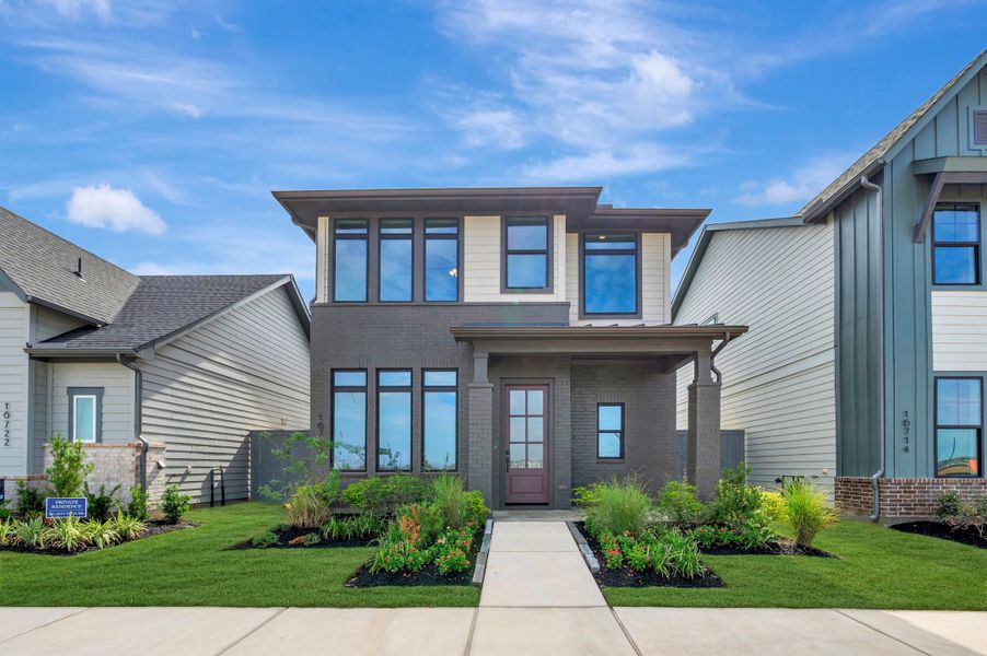 Front exterior of a new home in Jubilee - Cottages Row Collection, Hockley, TX, highlighting curb appeal (Image 27). Front exterior of a new home in Jubilee - Cottages Row Collection, Hockley, TX, highlighting curb appeal (Image 27).