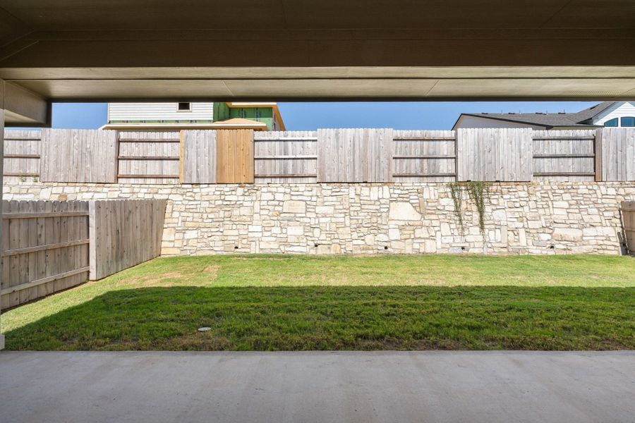 Exterior details and patio area of a home in Lariat, Liberty Hill (Image 29).