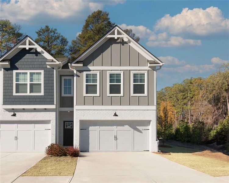 Front exterior of a new home in , Conyers, GA, highlighting curb appeal (Image 1). Front exterior of a new home in , Conyers, GA, highlighting curb appeal (Image 1).