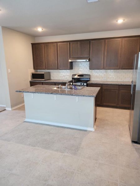 Kitchen view with granite countertops