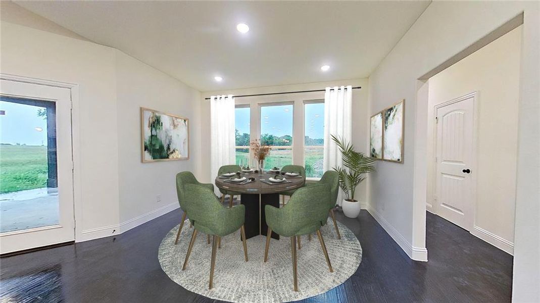 Dining room featuring dark wood-style floors and recessed lighting