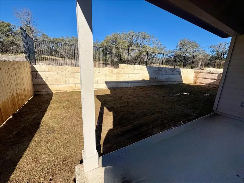 Exterior details and patio area of a home in Retreat at San Gabriel, Georgetown (Image 3).