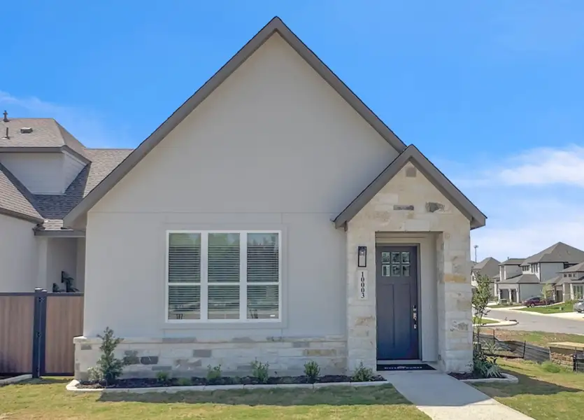 Front exterior of a new home in VIDA Townhomes, San Antonio, TX, highlighting curb appeal (Image 1). Front exterior of a new home in VIDA Townhomes, San Antonio, TX, highlighting curb appeal (Image 1).