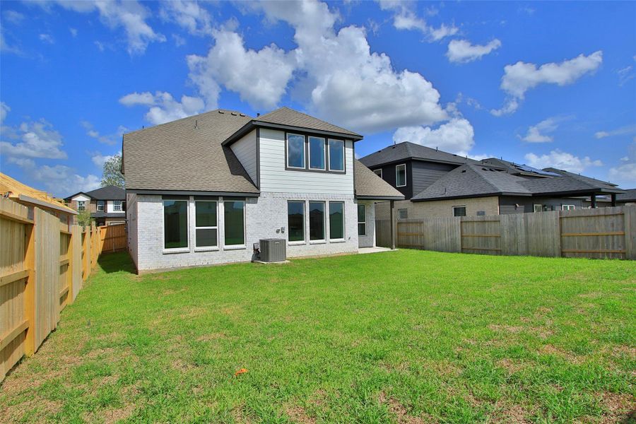 Exterior details and patio area of a home in Cypress Green, Tomball (Image 3).