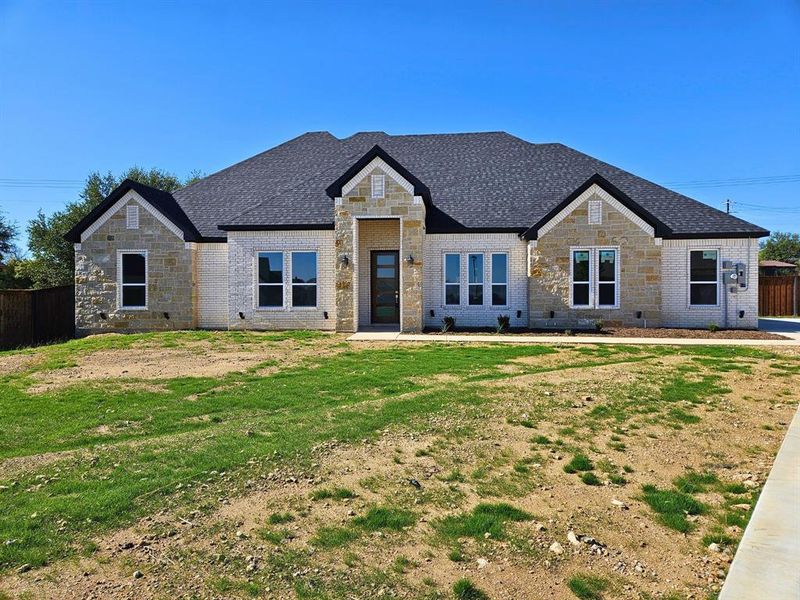 Front exterior of a new home in , Weatherford, TX, highlighting curb appeal (Image 21).