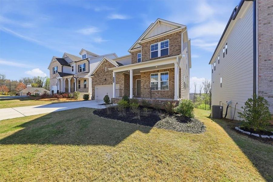 Front exterior of a new home in Falls Creek, Flowery Branch, GA, highlighting curb appeal (Image 31).