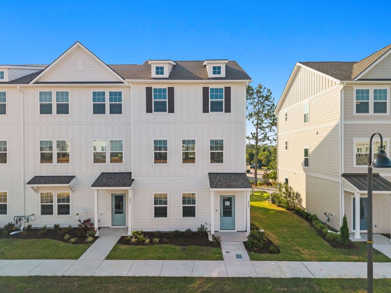 Front exterior of a new home in Lakeside Townes at Riverlights, Wilmington, NC, highlighting curb appeal (Image 1). Front exterior of a new home in Lakeside Townes at Riverlights, Wilmington, NC, highlighting curb appeal (Image 1).