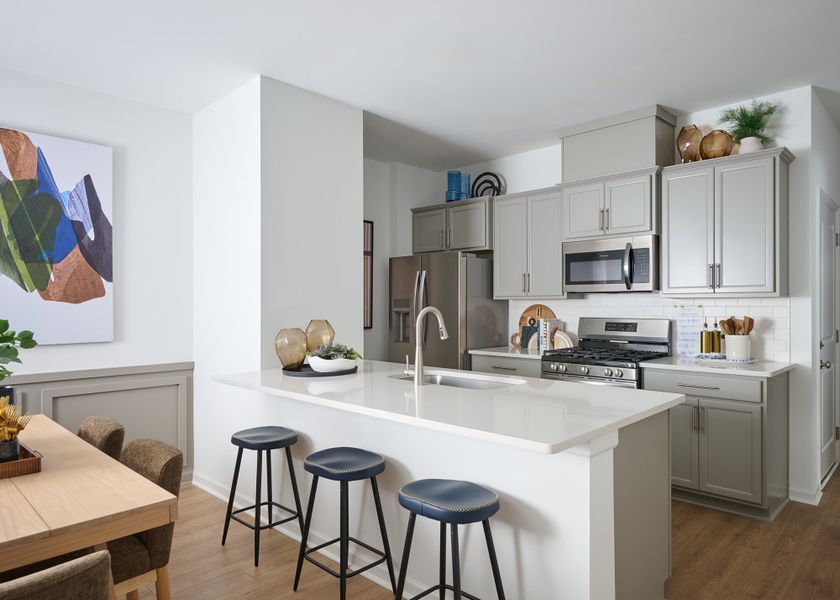 Representative furnished interior of a home built from the The Bunting Int by David Weekley Homes in Nexus Townhomes, Gallatin (Image 5).