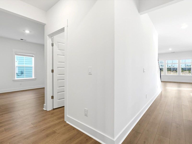 Spacious, unfurnished interior of a new home in The Coves at Lakes of Cane Bay, Summerville (Image 9).