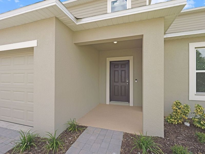 Representative exterior photo of a completed home built from the Azalea by Taylor Morrison in Scenic Terrace, Lake Hamilton, FL (Image 30).