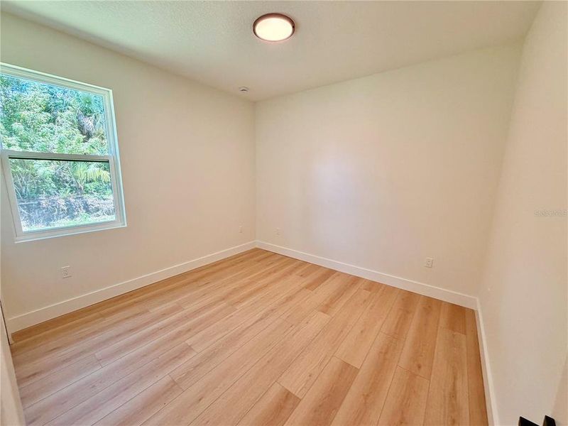 Spacious, unfurnished interior of a new home in , Port Charlotte (Image 56).