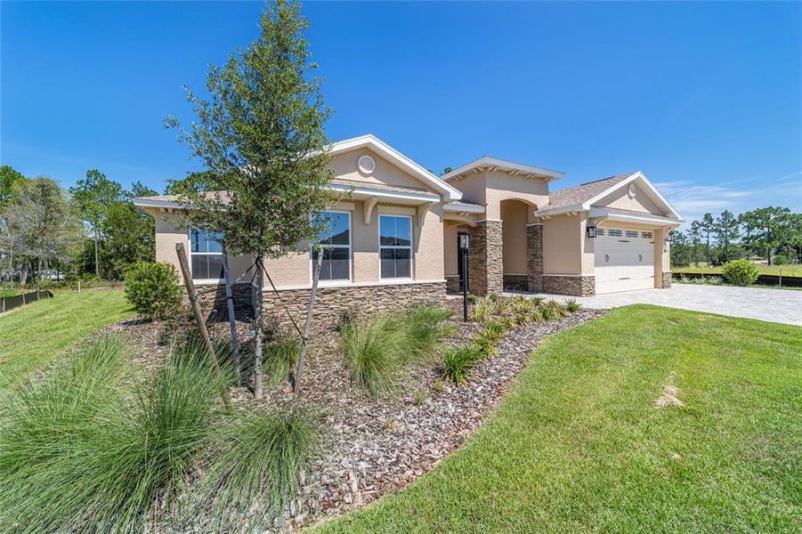 Front exterior of a new home in , Ocala, FL, highlighting curb appeal (Image 28).