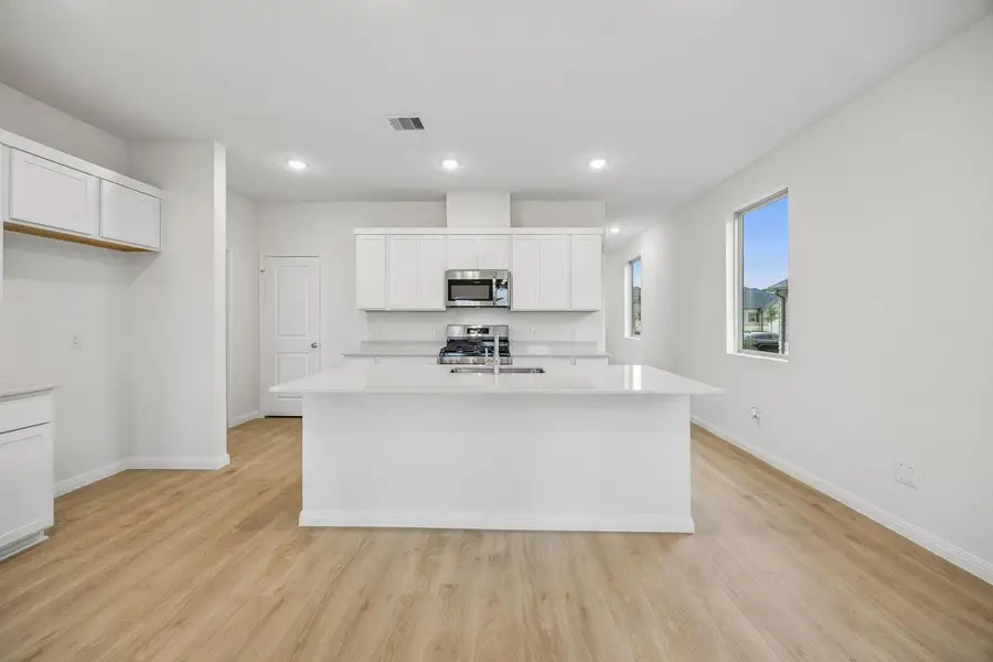 Kitchen in the Magnolia home plan by Trophy Signature Homes – REPRESENTATIVE PHOTO Kitchen in the Magnolia home plan by Trophy Signature Homes – REPRESENTATIVE PHOTO