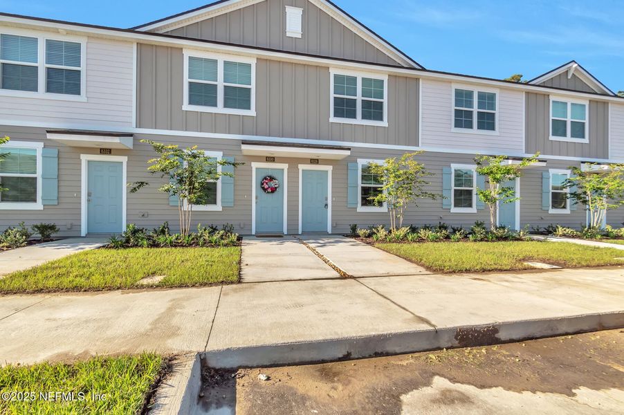 Front exterior of a new home in , Jacksonville, FL, highlighting curb appeal (Image 2). Front exterior of a new home in , Jacksonville, FL, highlighting curb appeal (Image 2).