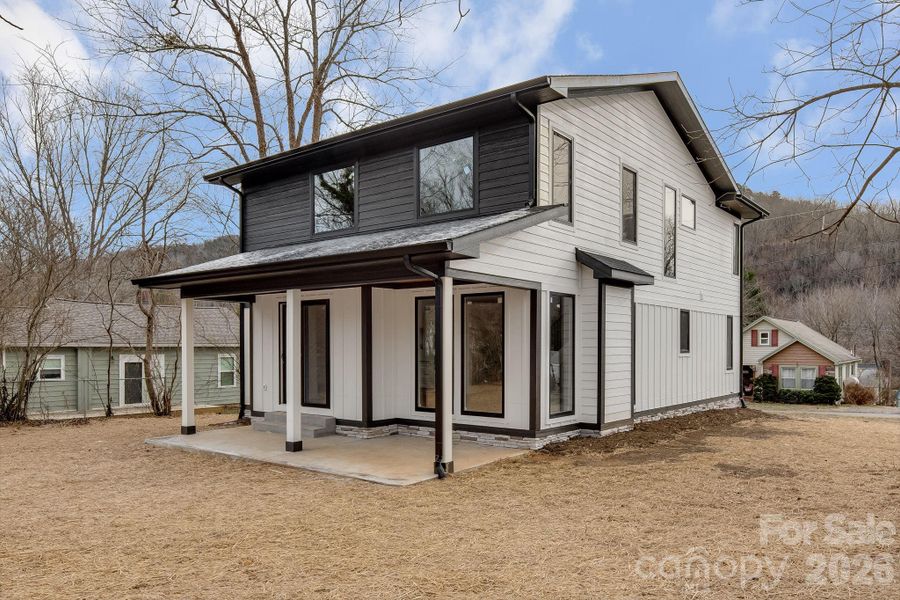 Exterior details and patio area of a home in , Black Mountain (Image 24).