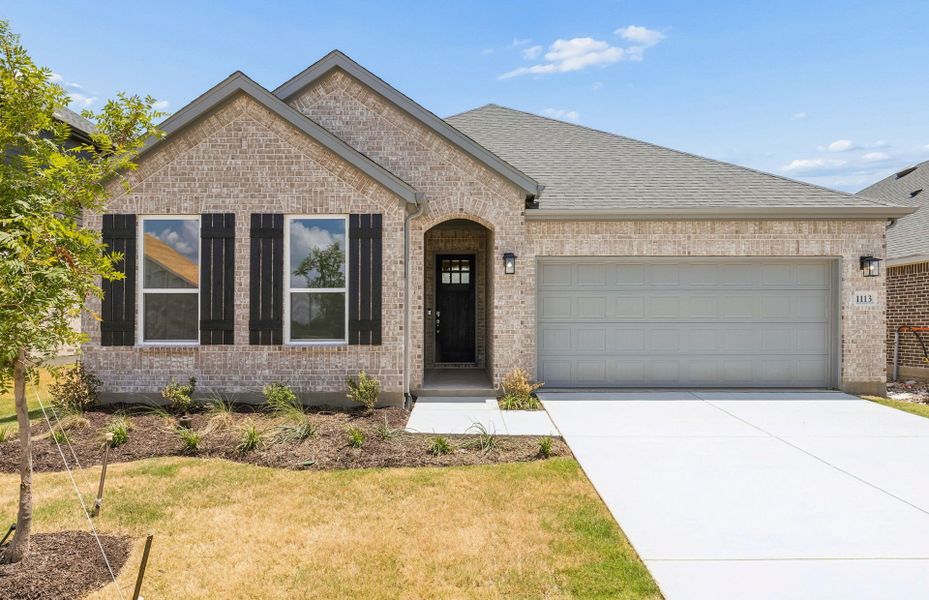 Front exterior of a new home in Ribbonwood, Aubrey, TX, highlighting curb appeal (Image 1). Front exterior of a new home in Ribbonwood, Aubrey, TX, highlighting curb appeal (Image 1).