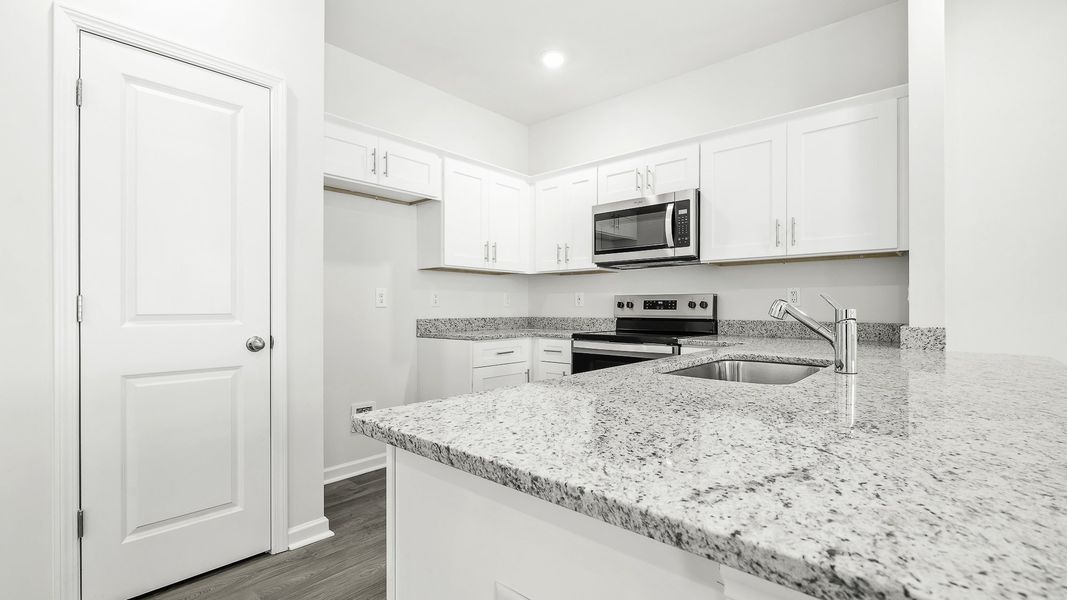 Furnished interior view inside a new home in North Village Townes, Greensboro (Image 3).