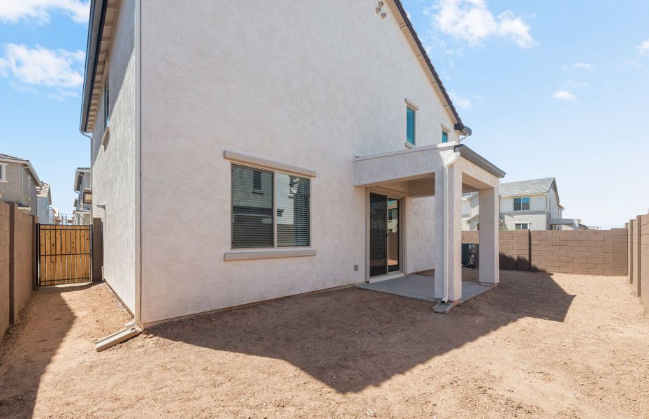 Exterior details and patio area of a home in Asante- Atrium Series, Surprise (Image 3).