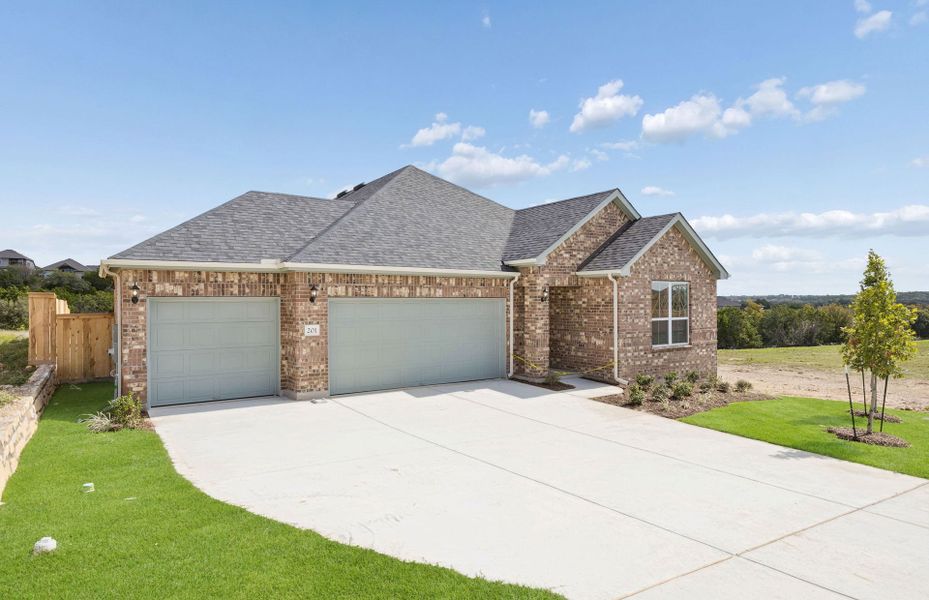 Front exterior of a new home in Crescent Bluff, Georgetown, TX, highlighting curb appeal (Image 18).