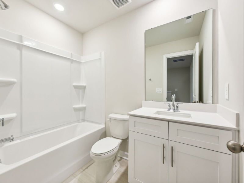 The secondary bathroom provides guests with their own space.