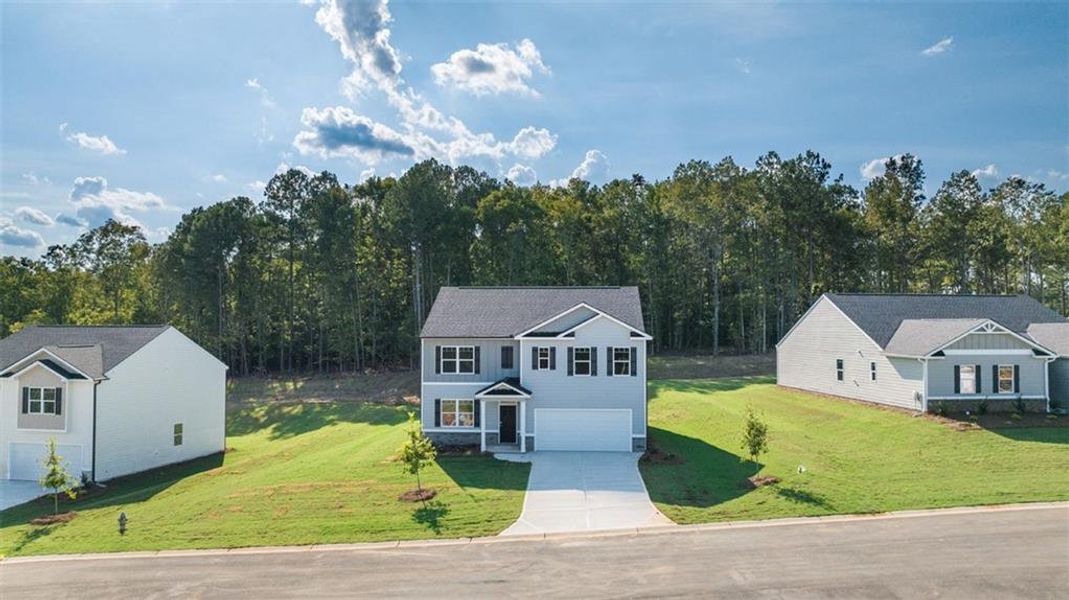 Front exterior of a new home in Kingston Ranch at Lake Oconee, Buckhead, GA, highlighting curb appeal (Image 27). Front exterior of a new home in Kingston Ranch at Lake Oconee, Buckhead, GA, highlighting curb appeal (Image 27).
