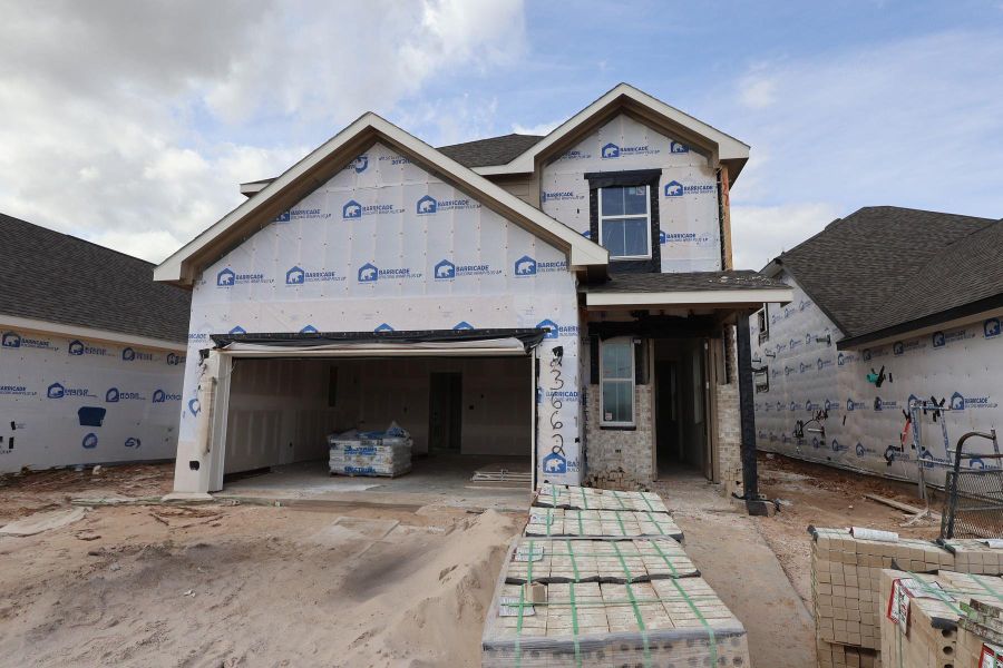 Two story home with 4 beds, 3.5 baths, and 2 car garage.