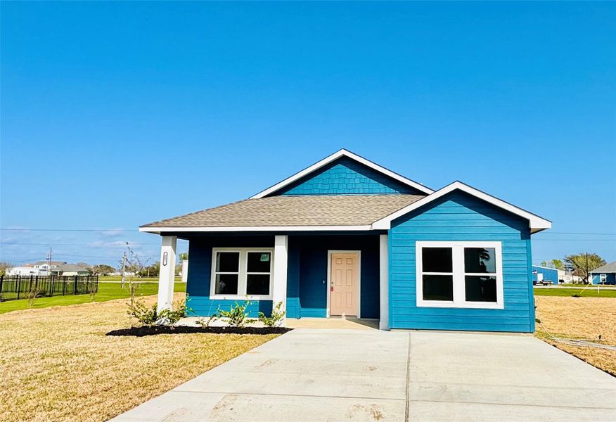 Front exterior of a new home in , Palacios, TX, highlighting curb appeal (Image 23). Front exterior of a new home in , Palacios, TX, highlighting curb appeal (Image 23).