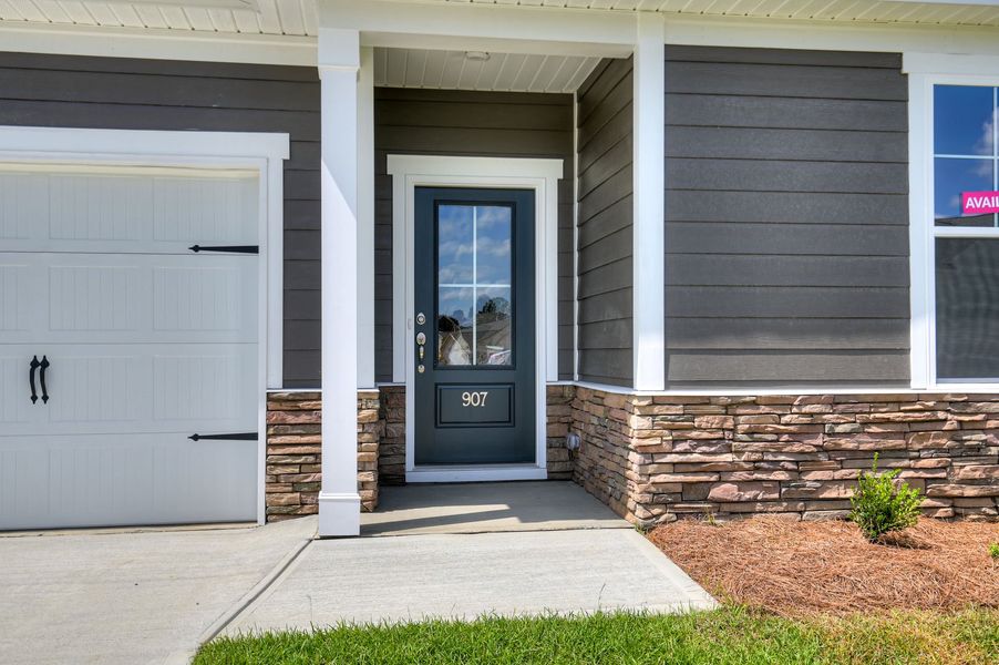Exterior details and patio area of a home in The Beacon at Old Peachtree Single Family Homes, Lawrenceville (Image 65).