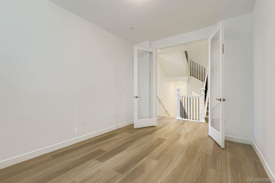 Spacious, unfurnished interior of a new home in Sunset Village: The Grand Collection, Erie (Image 12).