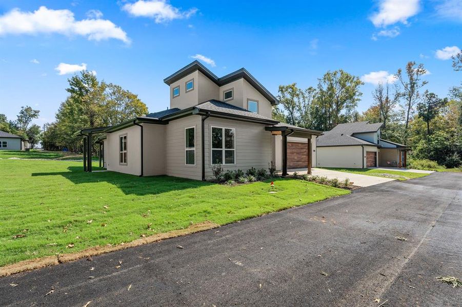Front exterior of a new home in , Lindale, TX, highlighting curb appeal (Image 1). Front exterior of a new home in , Lindale, TX, highlighting curb appeal (Image 1).