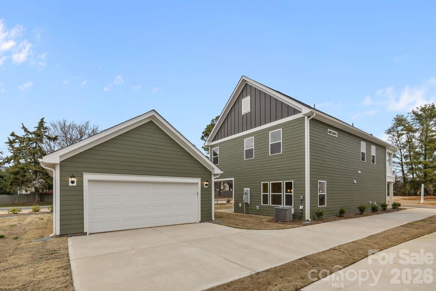 Front exterior of a new home in Arbor Village, Matthews, NC, highlighting curb appeal (Image 18).