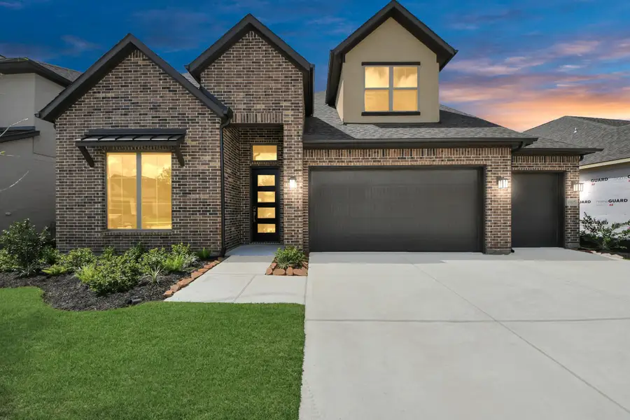 Front exterior of a new home in Marvida, Cypress, TX, highlighting curb appeal (Image 1).