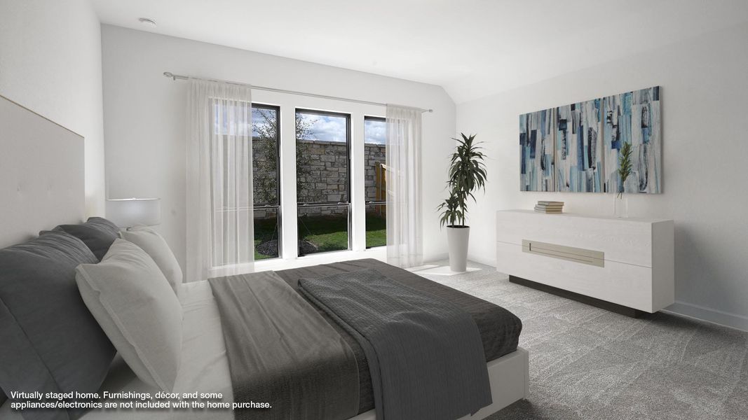 Carpeted bedroom with vaulted ceiling and baseboards Carpeted bedroom with vaulted ceiling and baseboards