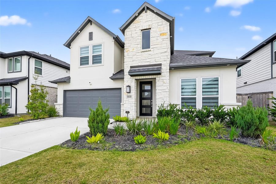 Front exterior of a new home in Avalon at Cypress, Cypress, TX, highlighting curb appeal (Image 24).
